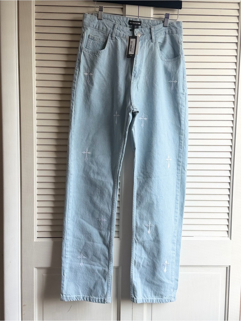 PRETTYLITTLETHING straight leg cross print jeans. New with tags!